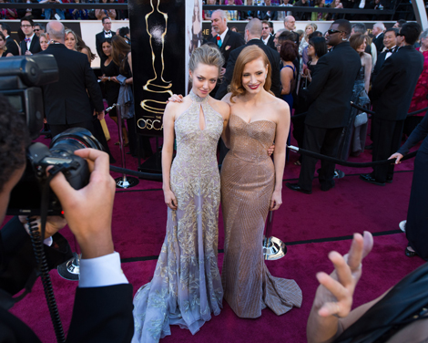 Amanda Seyfried (L) poses with Jessica Chastain (R), OscarÂ®-nominee for Actress in a Leading Role, as they arrive for The Oscars