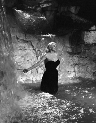 Anita Ekberg frolicing in the Trevi Fountain in "Le Dolce Vita"