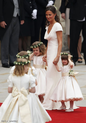 Sister of the bride and Maid of Honour Pippa Middleton (C) holds hands with Grace Van Cutsem (L) and Eliza Lopes